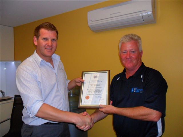 Craig White presenting Alex Shepherd from INCOSPEC with his Membership Certificate